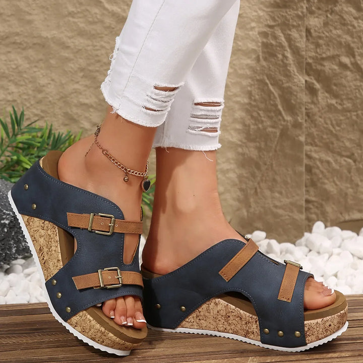 Stylish women's comfort slides with a supportive footbed and double buckles