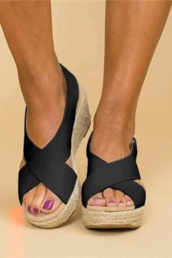 Close-up of women's comfortable espadrille wedge sandals, highlighting adjustable straps and orthopedic footbed.