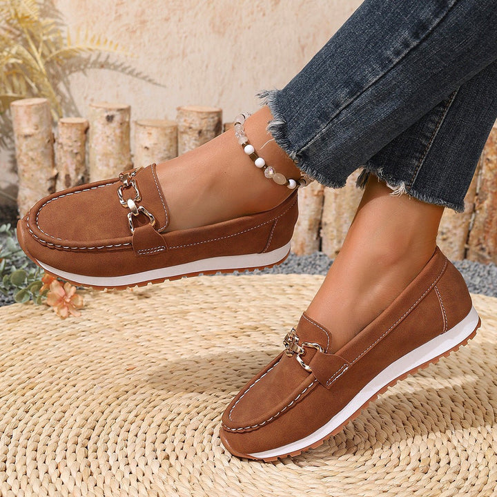 Slip-on women's loafers designed with arch support & wide toe box for optimal foot health.