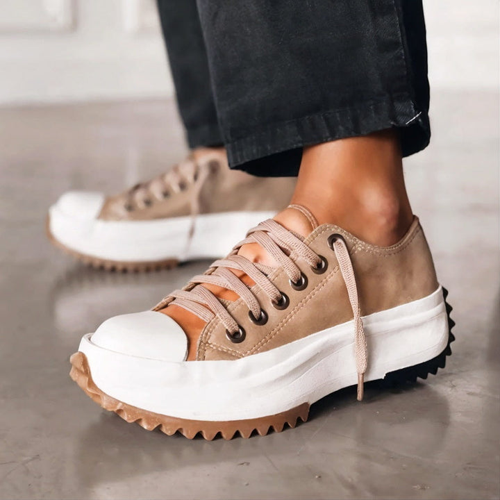 Comfortable women's low-cut lace-up orthopedic sneakers with a durable sole for walking.