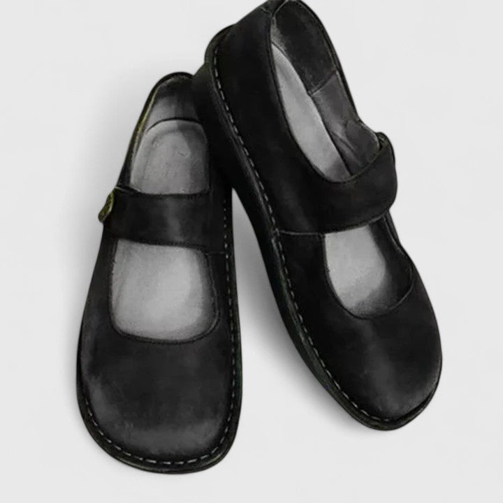 Supportive women's Mary Jane walking shoes, featuring arch support & adjustable strap for comfort.