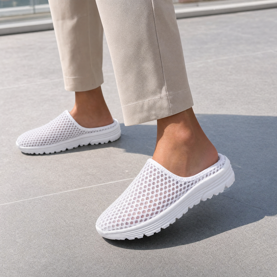 Easy-wear women's slip-on mesh sneakers, cushioned with arch support for daily comfort.
