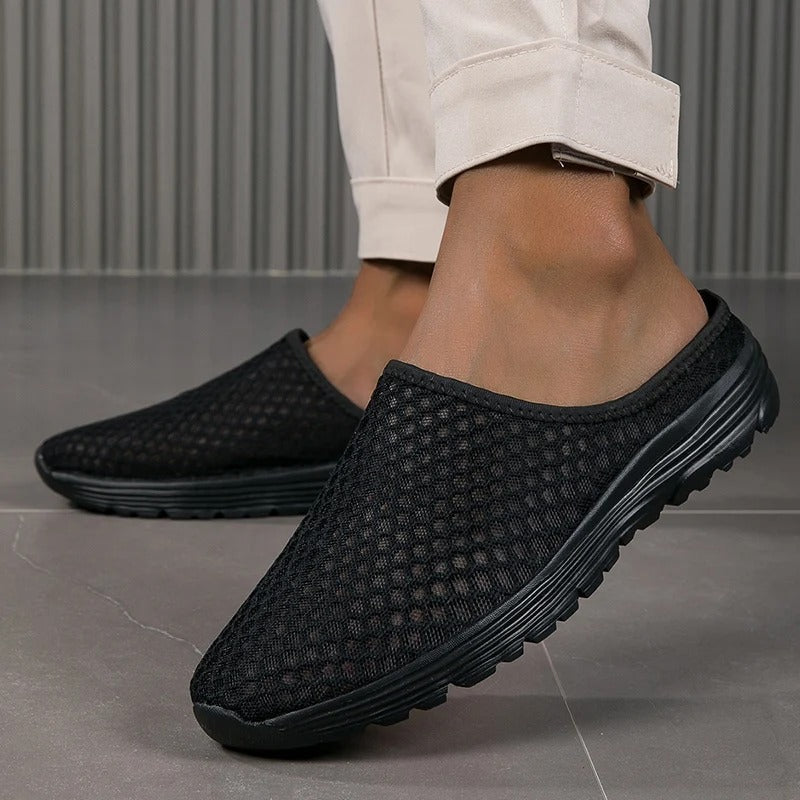 Comfortable women's slip-on sneakers with mesh upper, orthopedic design & arch support for all-day wear.