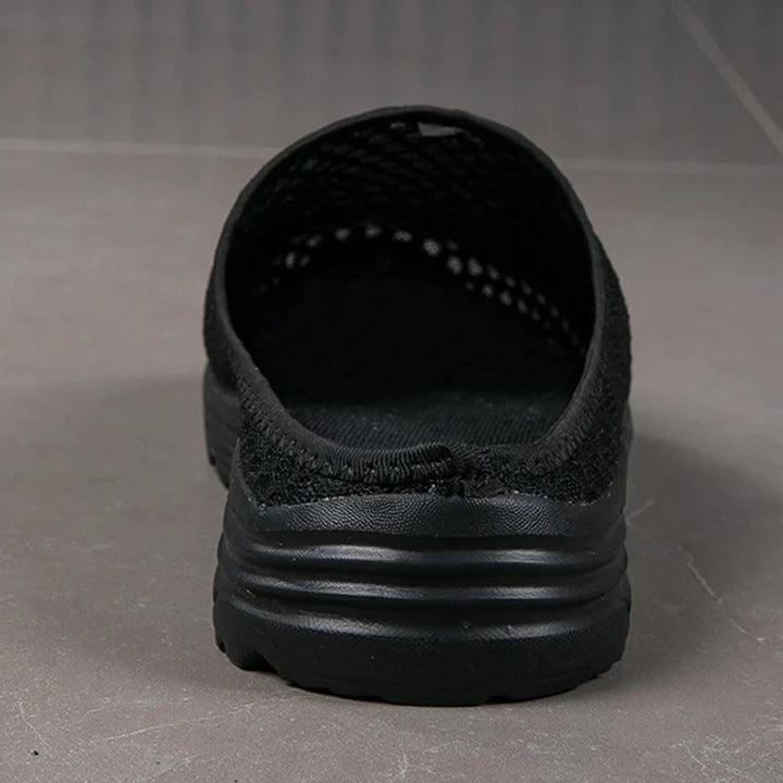 Women's slip-on orthopedic mesh walking sneakers, built-in arch support for cushioned foot comfort.