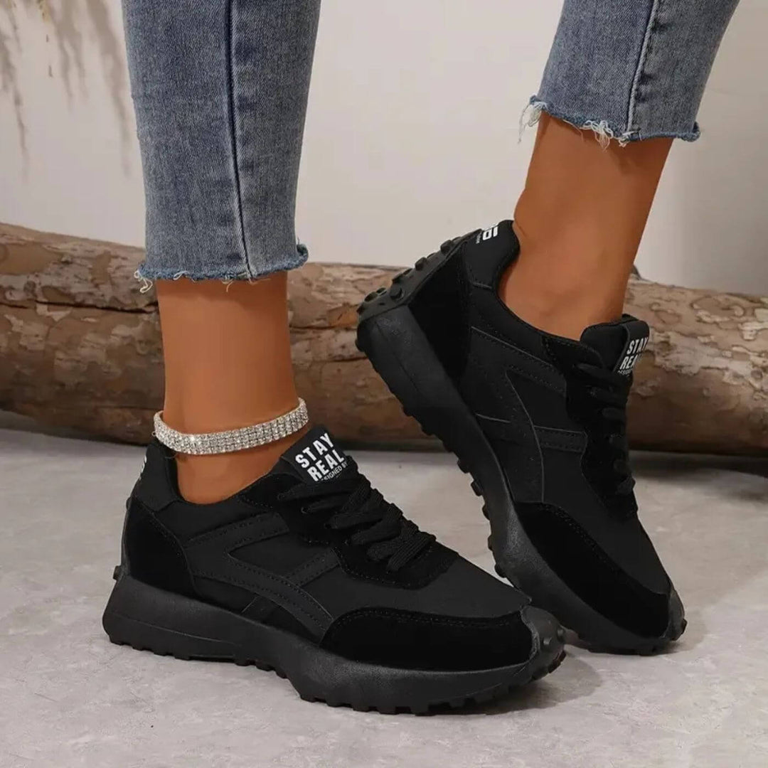 Stylish women's panel sneakers with a comfortable platform sole & lace-up design, perfect for casual & fashion wear.