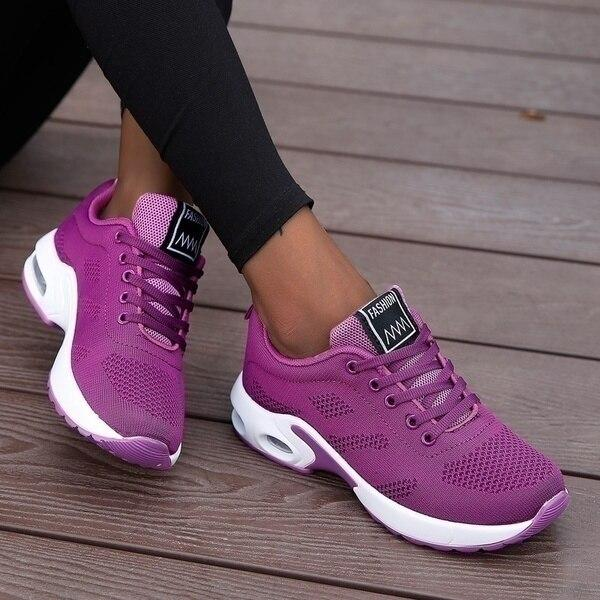 Rear view of women's orthopedic running shoes with reinforced heel for stability & foot support during runs.