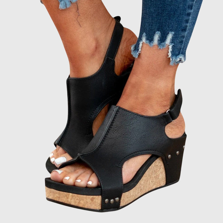 Close-up of women's orthopedic sandal, showcasing soft straps and supportive arch design.