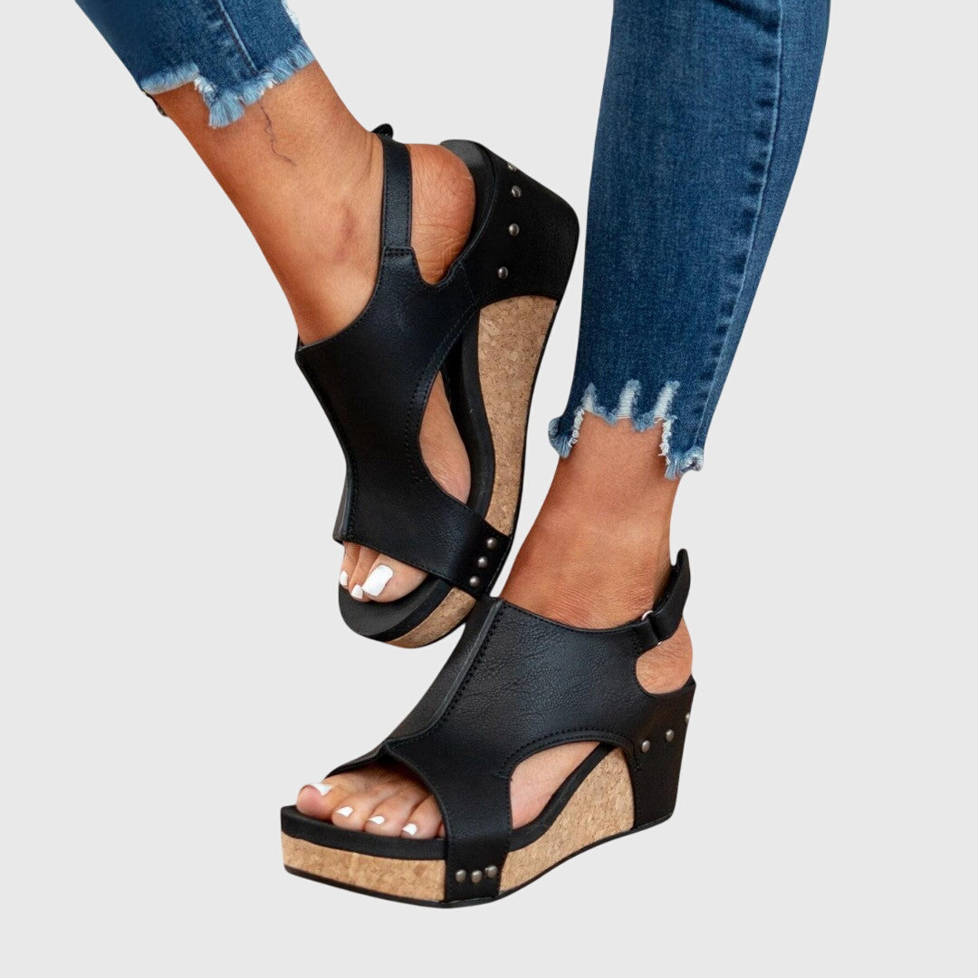 Pair of women's comfortable wedge sandals, perfect for stylish all-day walking and casual wear.