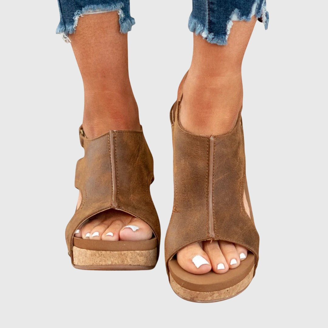 Front view of women's stylish sandals, highlighting the adjustable strap and ergonomic fit.