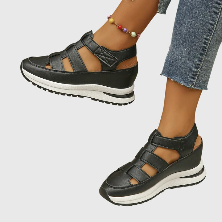 Supportive women's sandals, designed with orthopedic features & adjustable arch for optimal foot health.