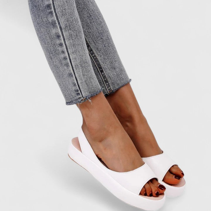 Open-toe women's orthopedic slip-on sandals, cushioned for maximum comfort & foot relief.