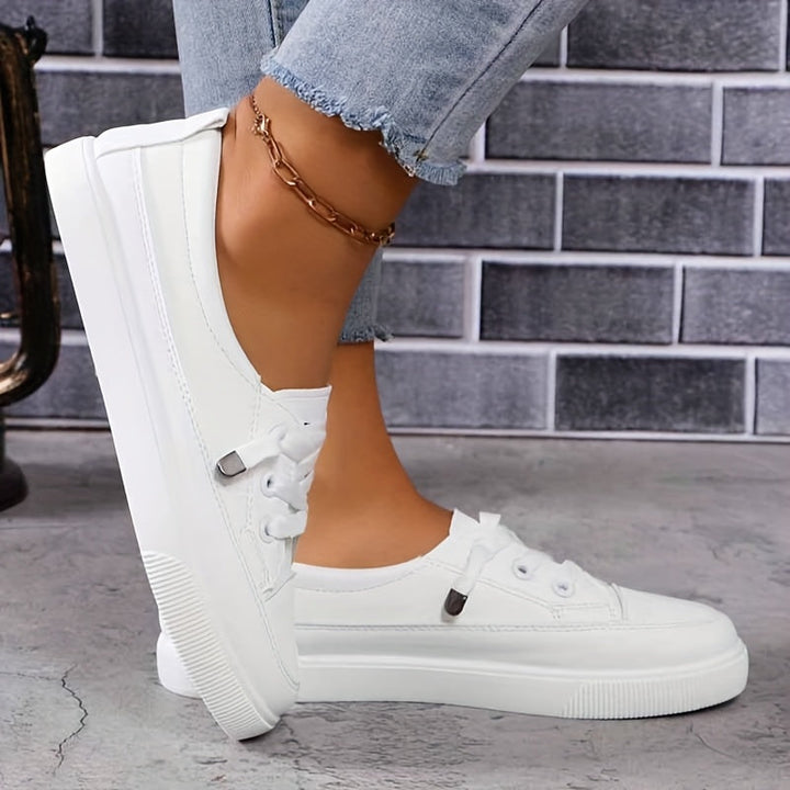 Stylish white women's orthopedic sneakers, comfortable platform design for everyday walking.