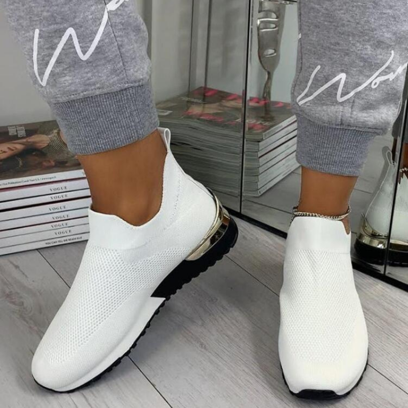 Women's orthopedic sneakers with posture support, promoting wellness footwear.