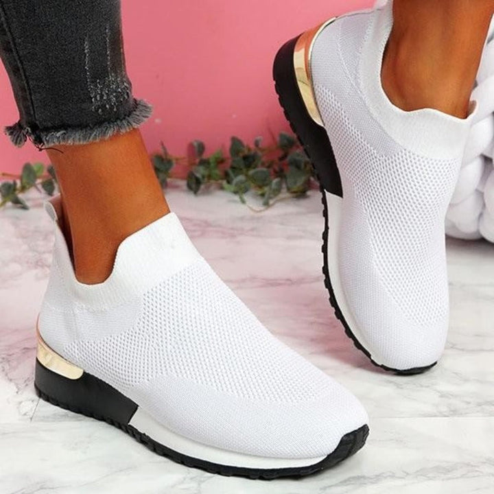 Lace-up athletic women's orthopedic sneakers, supportive for active lifestyles.