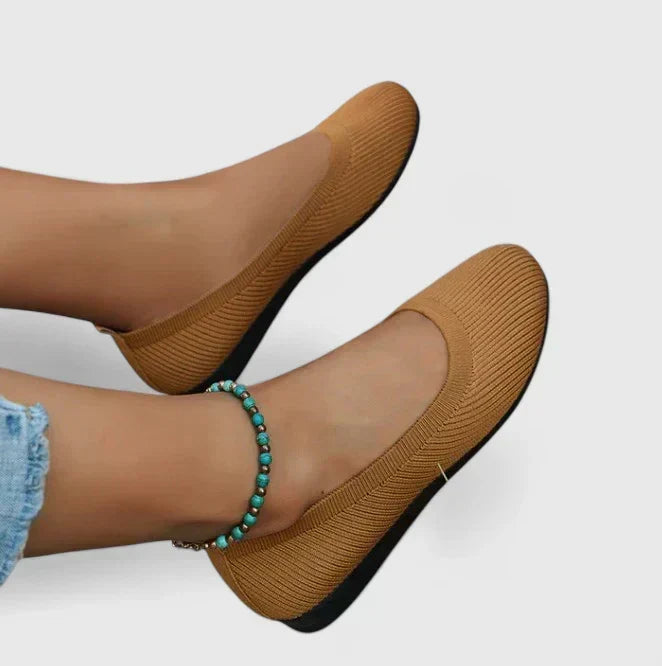 Side view of women's orthopedic walking shoes, showcasing a flexible upper and sturdy non-slip sole.