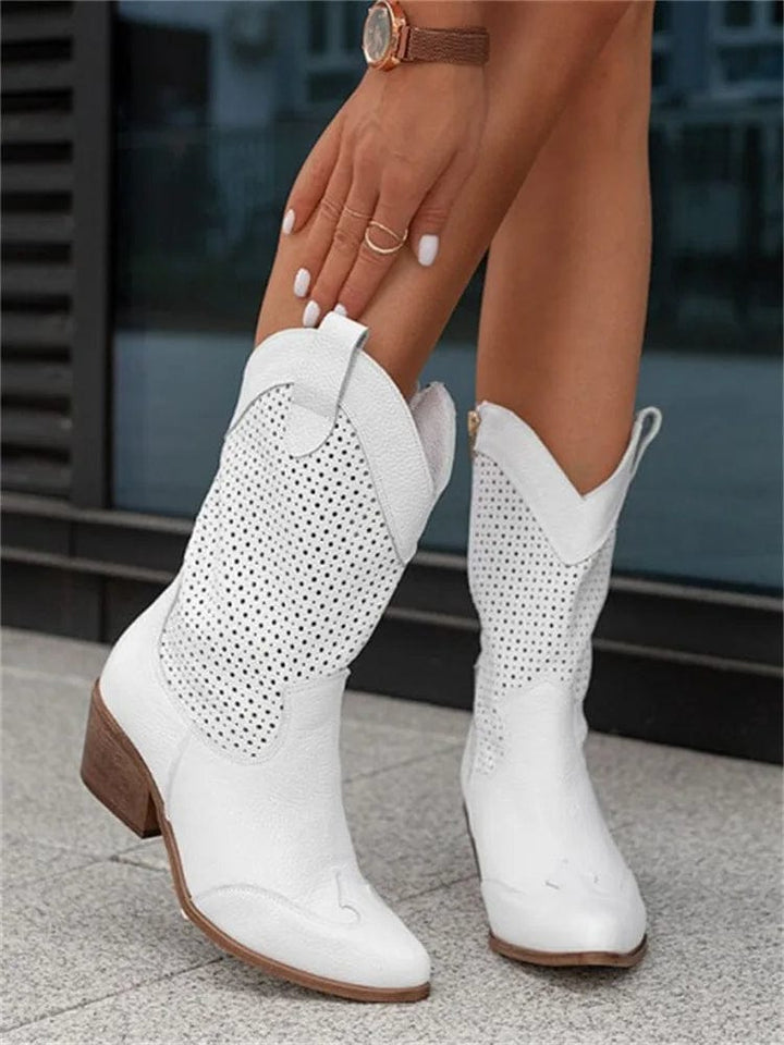 Women's western ankle boots with visible side zipper, orthopedic comfort, and a stylish block heel.