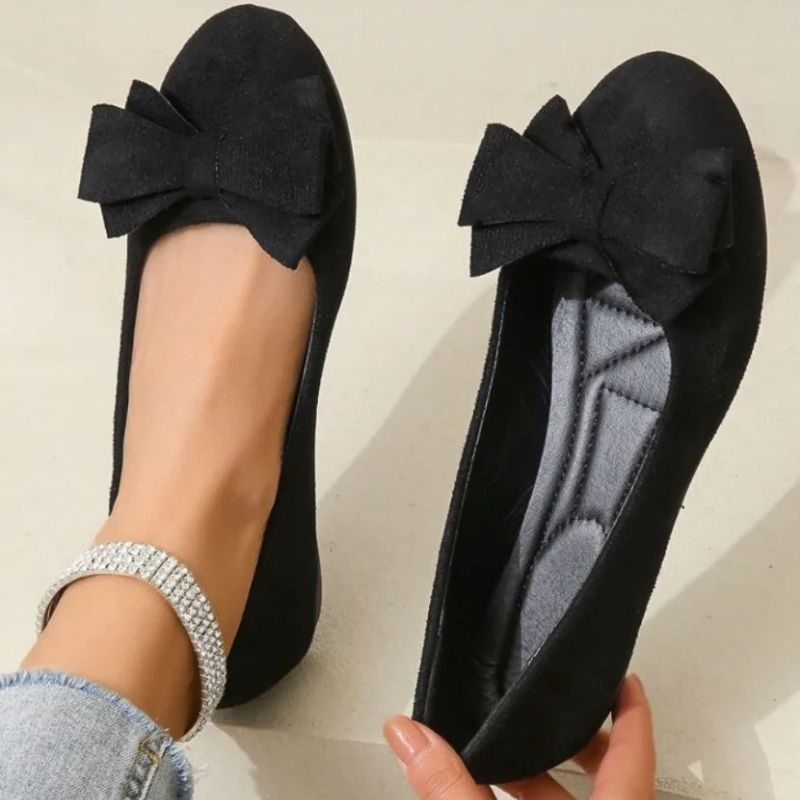 Stylish women's wide fit ballet flats offering orthopedic support for all-day comfort.