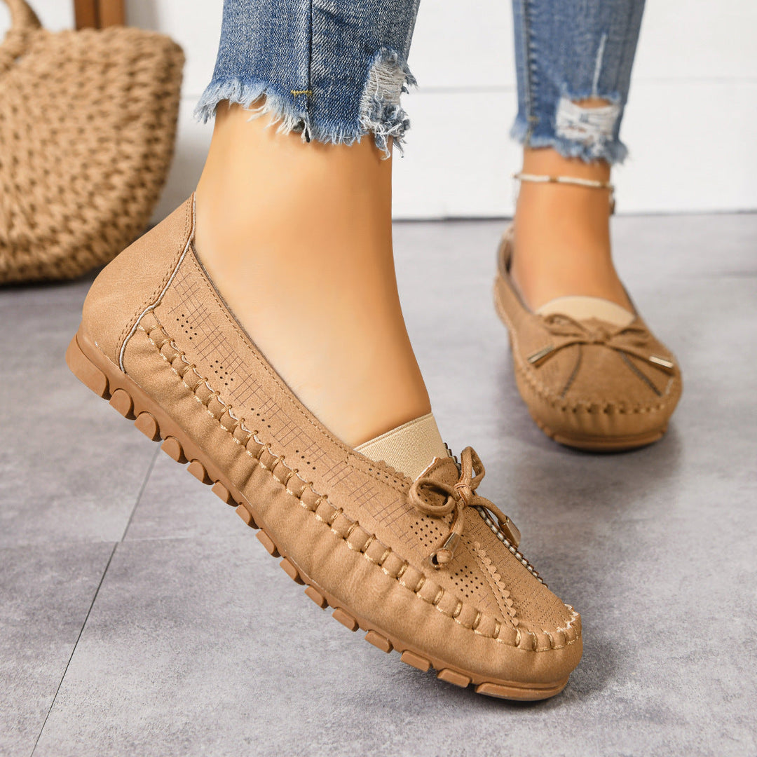 Brown women's wide fit slip-on orthopedic loafers, offering cushioned comfort & foot support.