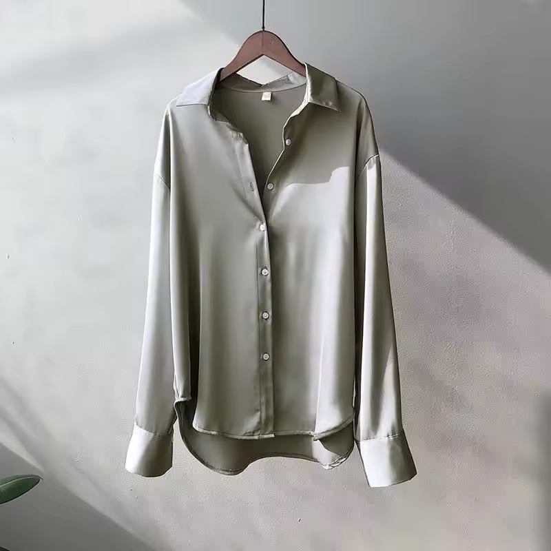 Chic women's oversized long-sleeve button-down blouse. Relaxed fit for effortless casual or professional wear.