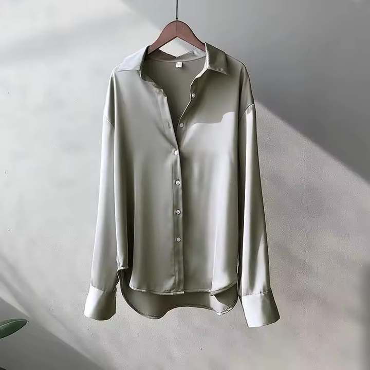 Chic women's oversized long-sleeve button-down blouse. Relaxed fit for effortless casual or professional wear.
