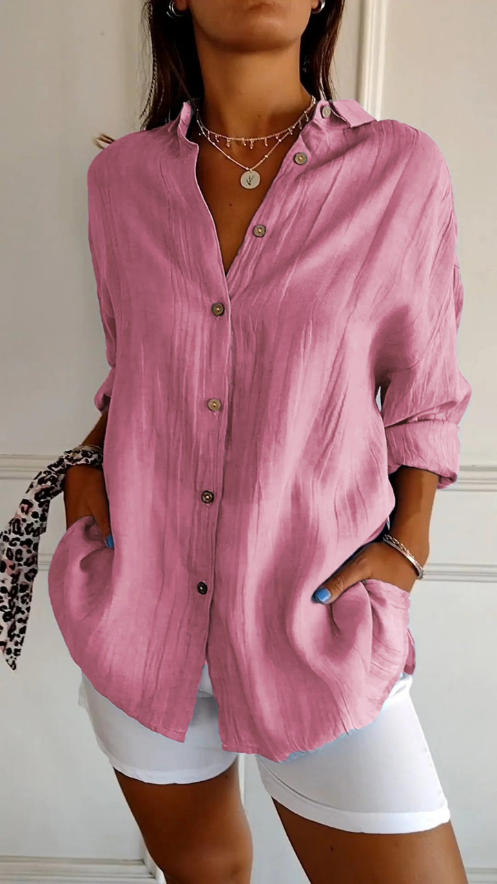 Effortless women's oversized button-down shirt, long sleeve, great for relaxed everyday wear.