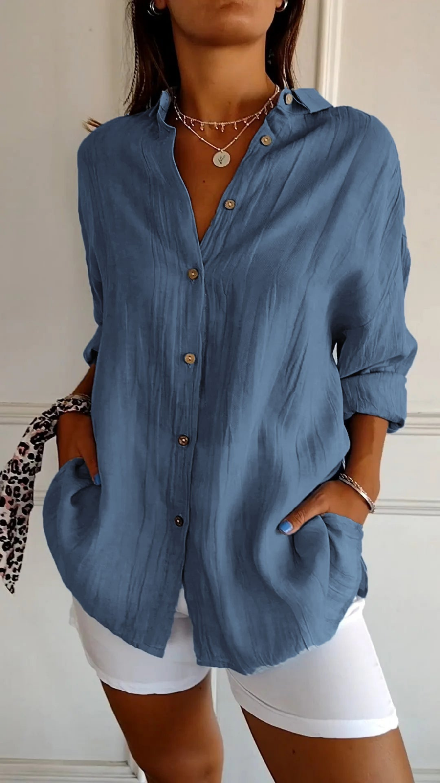 Relaxed fit women's oversized button-down shirt, perfect as a chic long-sleeve summer top.