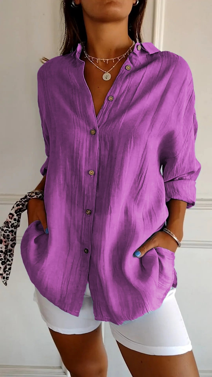 Chic women's long-sleeve button-down shirt, oversized for a relaxed fit, perfect for summer.