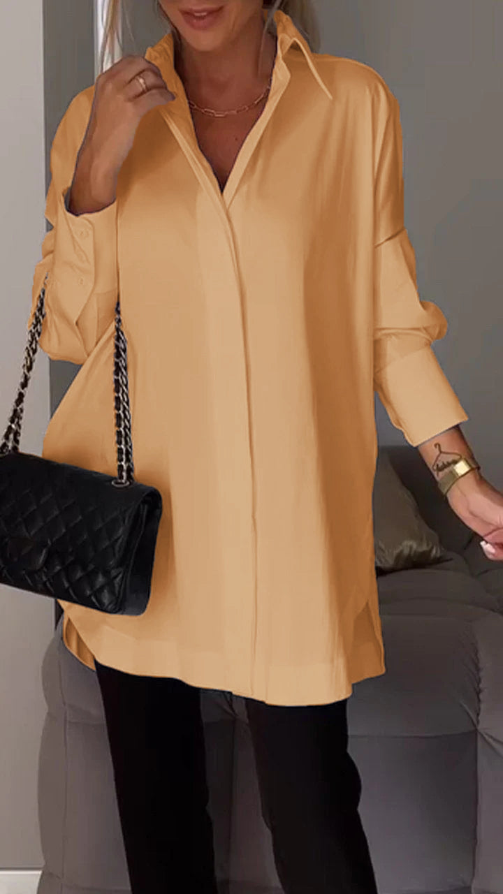 Women's stylish oversized blouse featuring a prominent folded collar, long sleeve, relaxed fit.