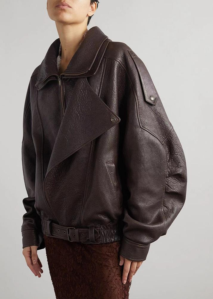 Women's oversized faux leather bomber jacket in brown with a belted waist, chic outerwear.