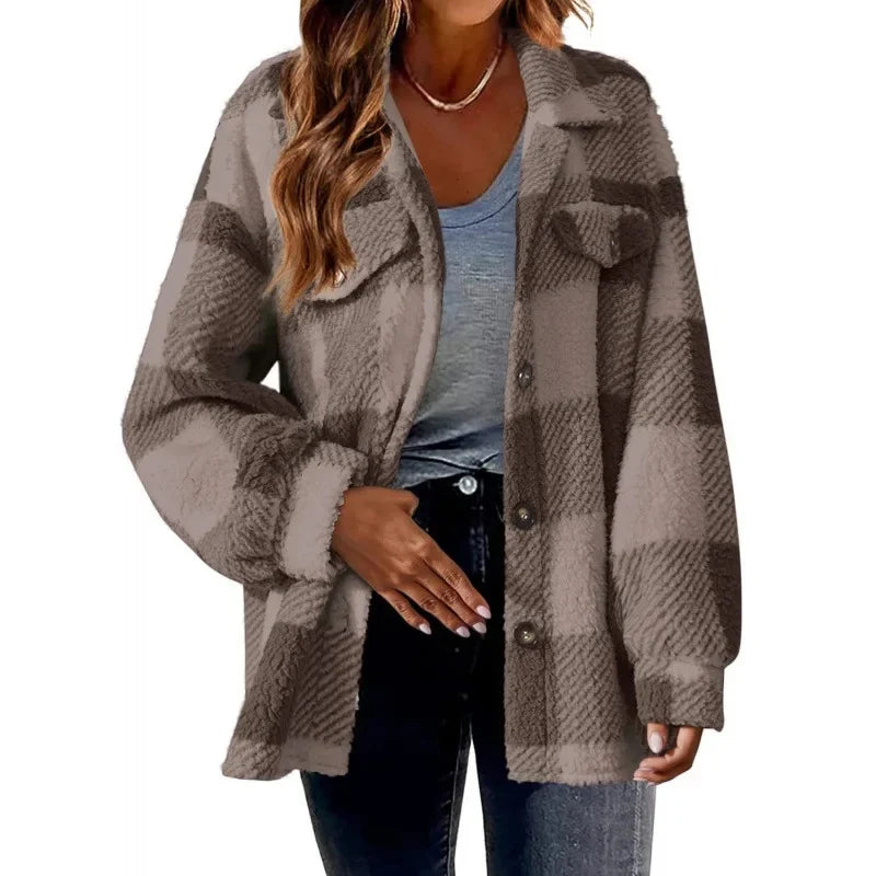 Warm women's oversized fleece shacket in a plaid design, button-up, casual outerwear.
