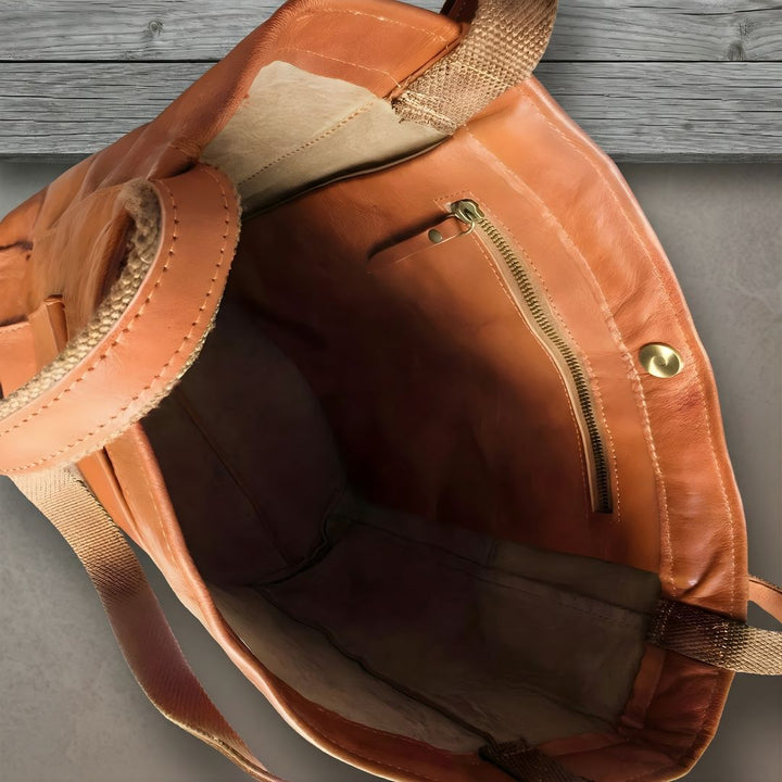 Durable women's oversized leather tote bag. Features a spacious main compartment & a large, accessible external pocket.