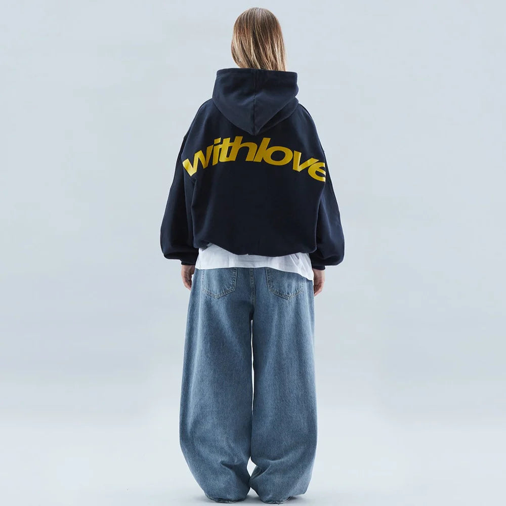 Trendy women's cropped hoodie featuring a bold graphic design and oversized fit for streetwear fashion.