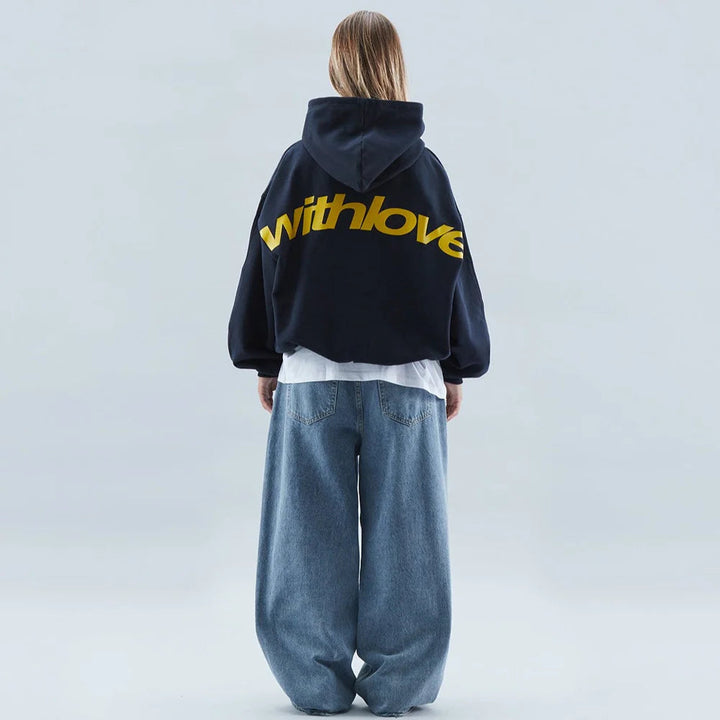 Trendy women's cropped hoodie featuring a bold graphic design and oversized fit for streetwear fashion.