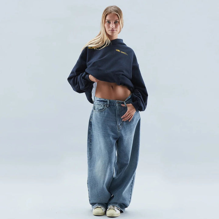 Stylish women's oversized graphic cropped hoodie with drop shoulder, ideal for modern streetwear looks.