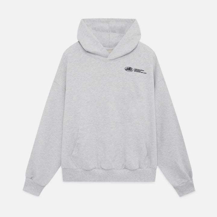 Woman wearing a stylish oversized graphic cropped hoodie, showcasing trendy streetwear apparel.