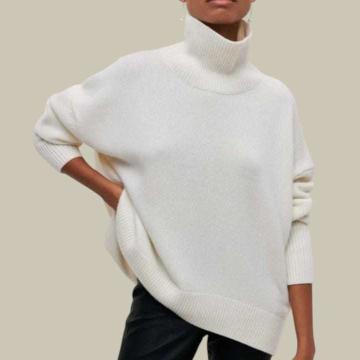 Model wearing a fashionable women's winter oversized loose fit turtleneck sweater