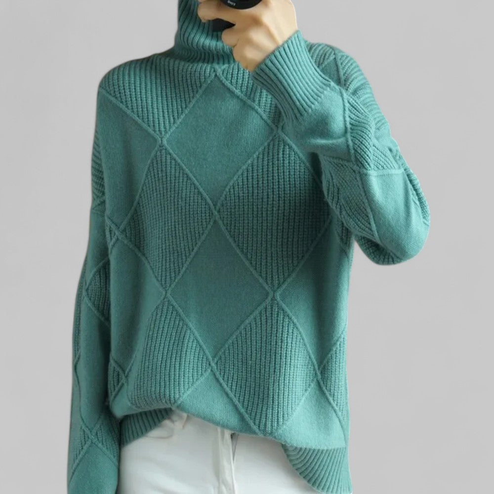 Luxurious women's oversized patterned turtleneck sweater, a cozy and fashionable winter knitwear choice.