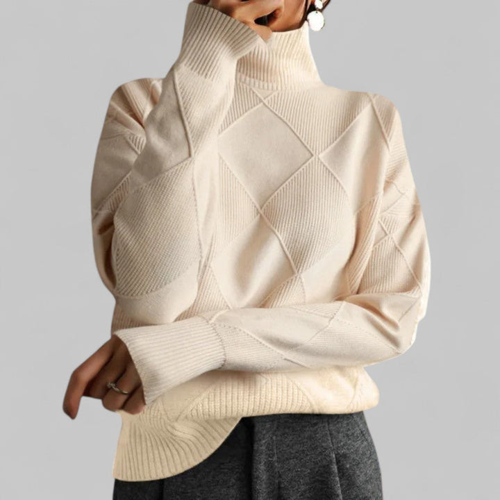 Stylish women's oversized turtleneck sweater featuring an intricate pattern, a winter fashion must-have.