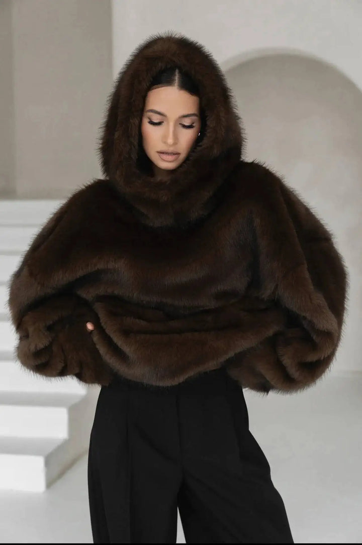 Soft plush women's oversized hoodie in a chic winter pullover style. Ideal for cozy loungewear & casual warmth.