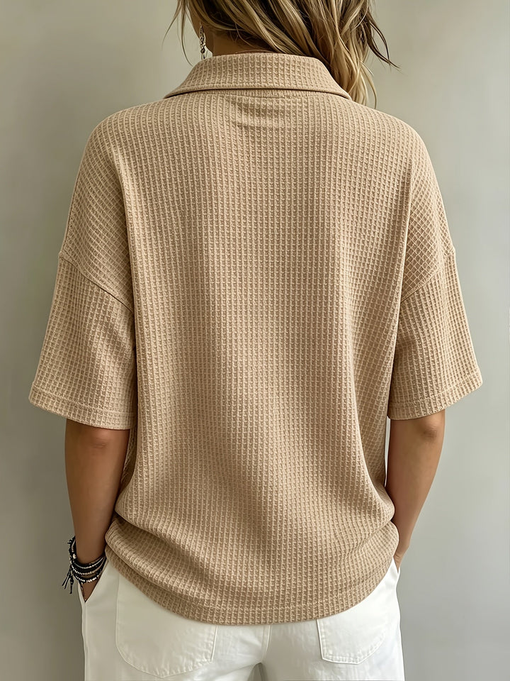 Women's casual oversized polo top with a relaxed fit, drop shoulder sleeves, and a practical button placket.
