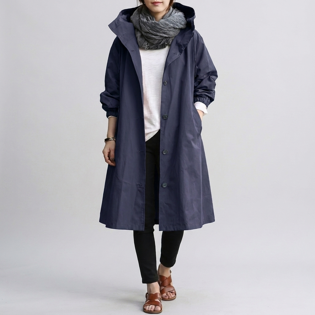 Women's oversized waterproof coat, combining trendy style with practical rain protection.