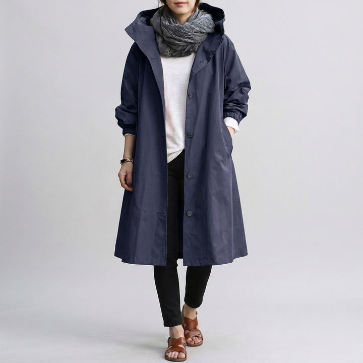 Women's oversized waterproof coat, combining trendy style with practical rain protection.