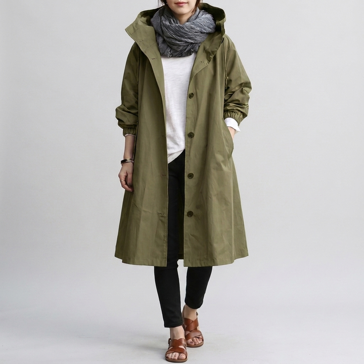 Woman in a chic oversized rain jacket, lightweight & waterproof, perfect for stylish weather protection.