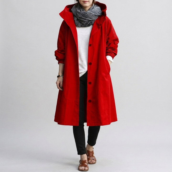 Close-up of the hood & waterproof zipper on a women's trendy oversized rain jacket, emphasizing quality.