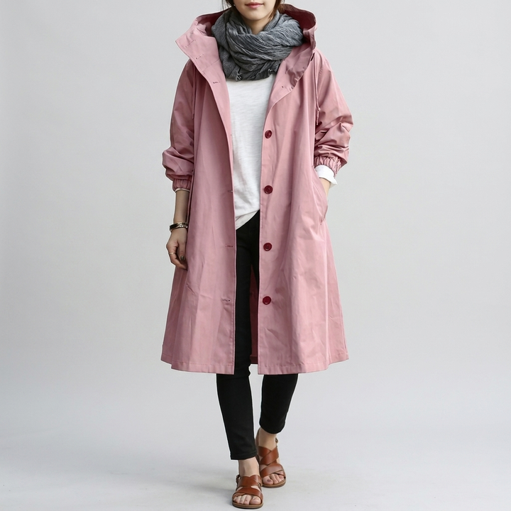 Back view of a women's oversized rain jacket, showcasing its relaxed, modern silhouette & weather protection.