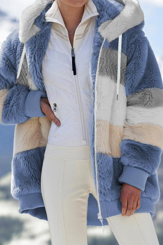 Fashionable women's oversized striped winter coat. Plush, hooded, and warm outerwear.