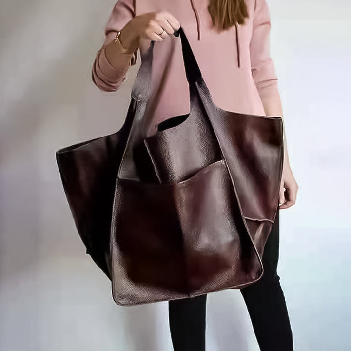 Women's oversized vintage leather shoulder bag, versatile and stylish accessory.