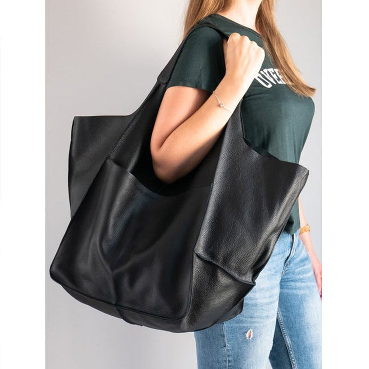 Women's oversized vintage leather shoulder bag, with ample space for essentials.