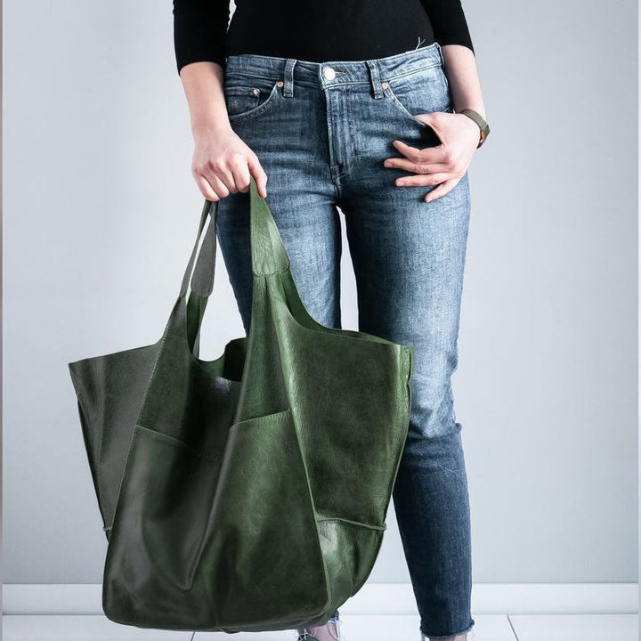 Women's oversized vintage leather shoulder bag, featuring a timeless design.
