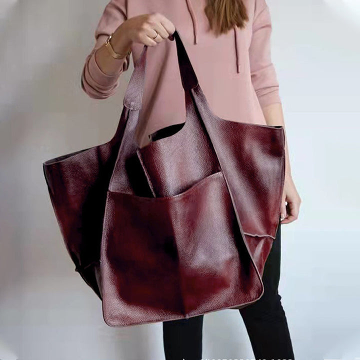 Practical women's oversized vintage leather tote bag, easy to carry on shoulder.